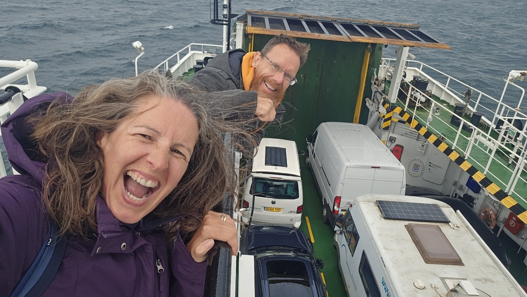 Ju and Jay on the ferry looking at the roof of the vehicles