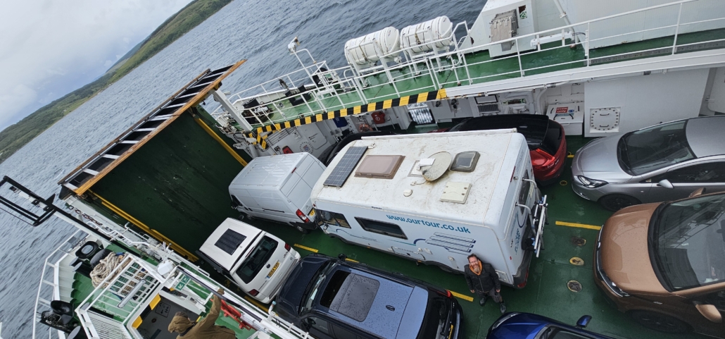 Looking down onto the roof of vehicles on a ferry