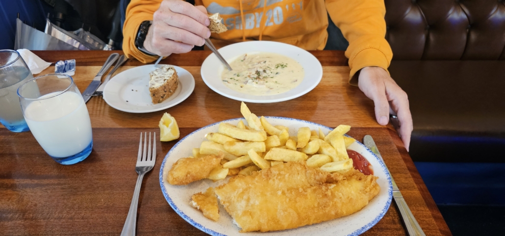 Plate of fish and chips and a bowl of fish chowder