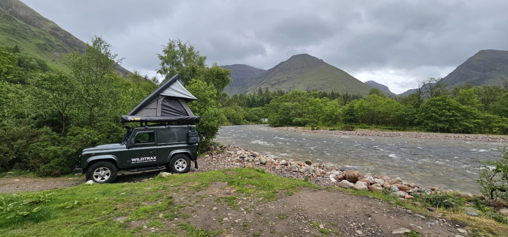 4x4 with roof tent by the river coe at red squirrel campsite glen coe