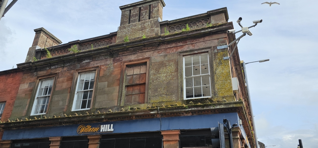 Building with brick window next to normal window