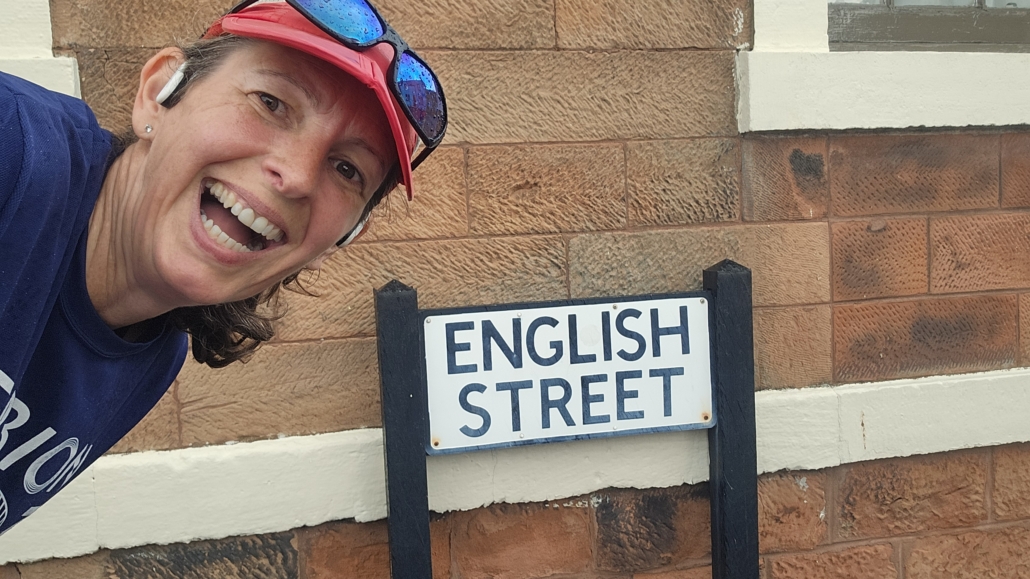 Me with a road sign for English Street