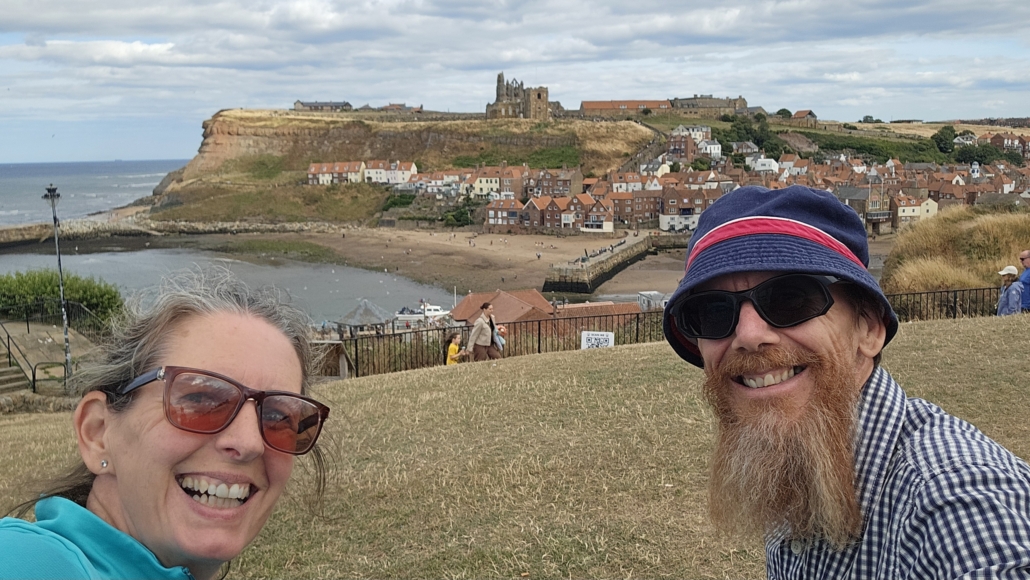 Ju and Jay with the ruins of Whiby Abbey in the background