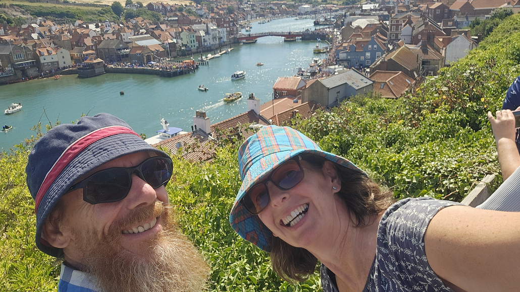 Jay and Julie on a viewpoint overlooking Whitby harbour