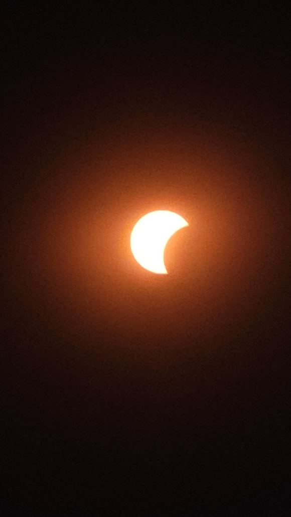 Images of the sun with moon covering increasing amounts of the sun
