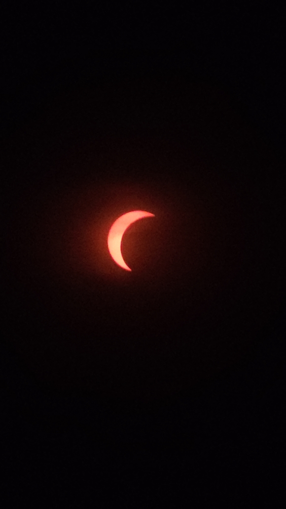 Images of the sun with moon covering increasing amounts of the sun